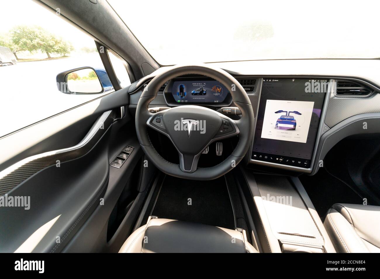 The interior of a full-sized, all-electric, luxury, crossover SUV Tesla Model X. Black and grey. Stock Photo