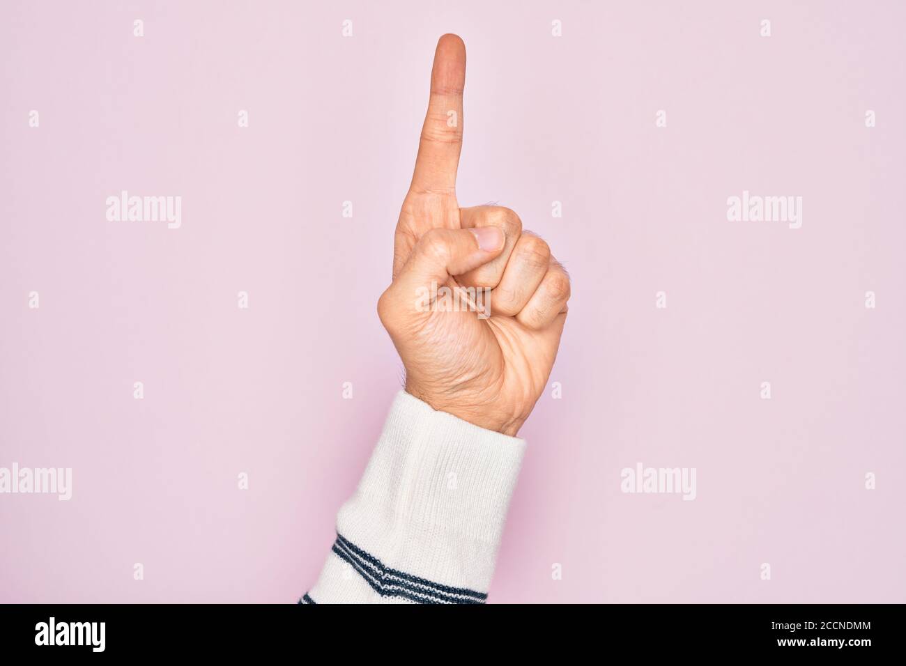 Hand of caucasian young man showing fingers over isolated pink ...