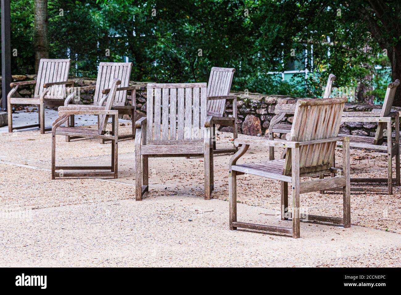 Chairs with no people in them appear abandoned and forlorn, representing the many closed businesses, campuses, and public spaces Stock Photo