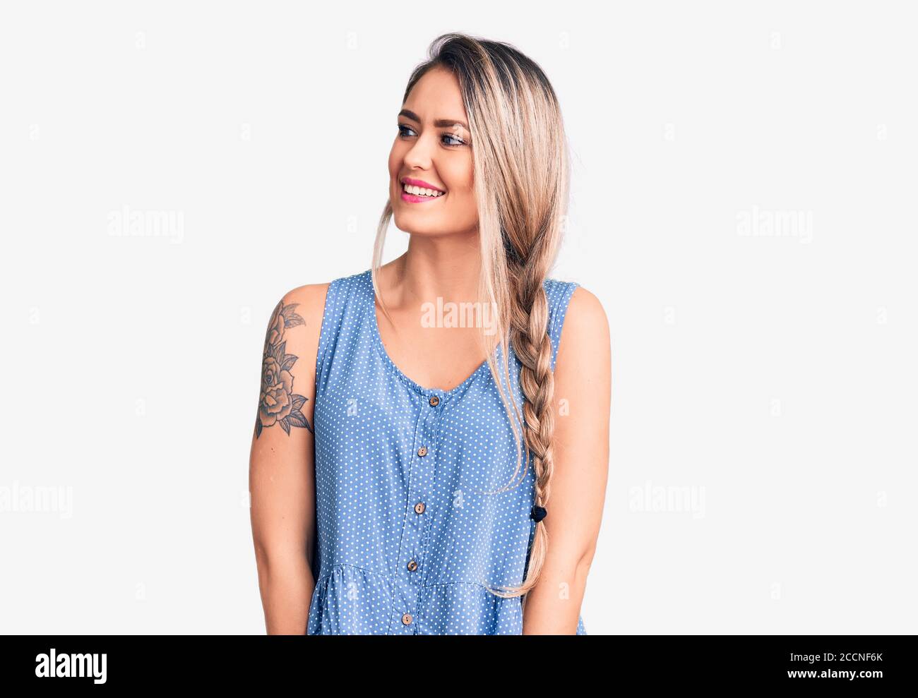 https://c8.alamy.com/comp/2CCNF6K/young-beautiful-blonde-woman-wearing-casual-sleeveless-t-shirt-looking-away-to-side-with-smile-on-face-natural-expression-laughing-confident-2CCNF6K.jpg