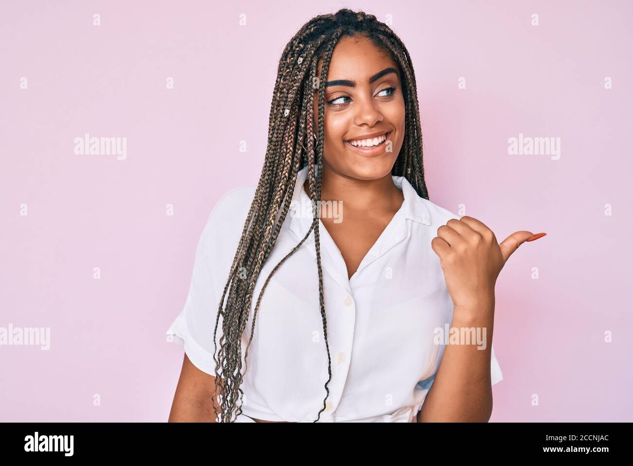 Young african american woman with braids wearing casual summer shirt ...
