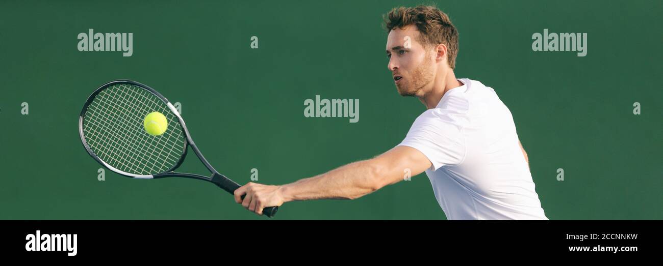 Tennis player hitting ball with backhand racket on hard court. Man playing game returning ball on panorama banner. Sports and fitness active lifestyle Stock Photo