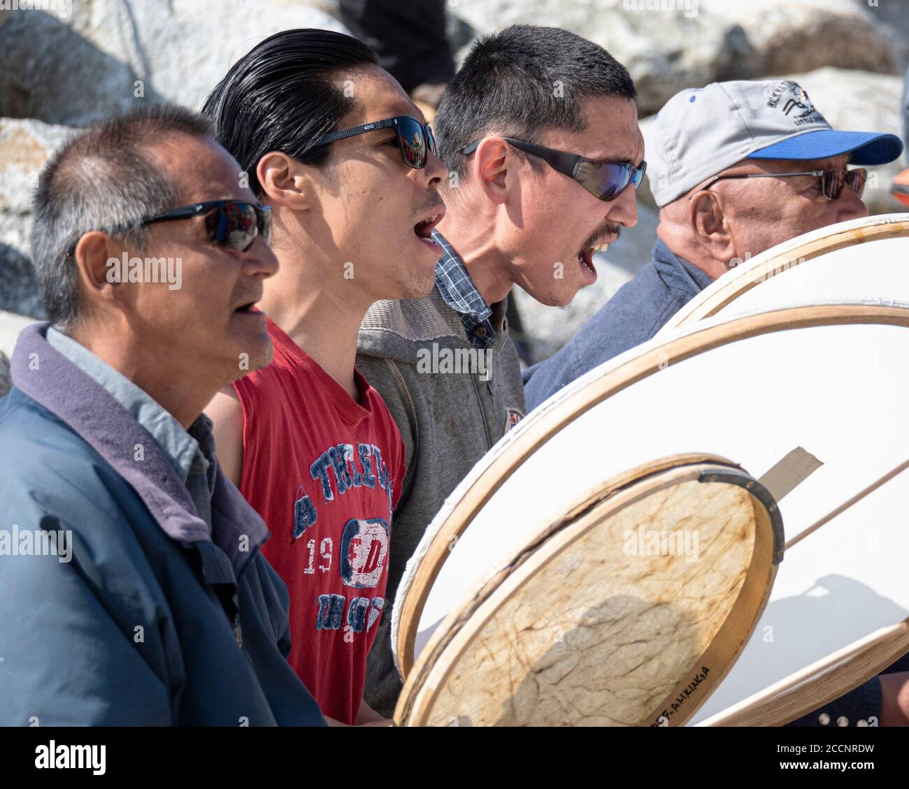 Inupiat native drummers perform in Diomede City on Little Diomede Island, Alaska, USA. Stock Photo