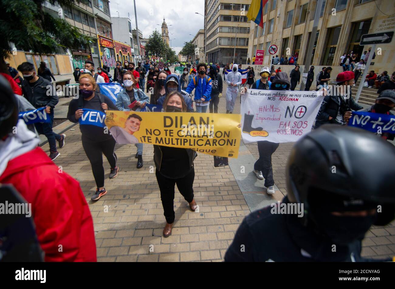 Bogota, Colombia. 23rd Aug, 2020. Alejandra Media, mother of deceased high school student, Dilan Cruz killed by riot police, holds a sign that reads in spanish 'Dilan they didn't silenced you, they multiplied you! the national strike goes on' on August 23 2020 in Bogota, Colombia. Dilan Cruz was a high school student who was shot by a riot police officer during the 2019 national strike in Colombia, on the demonstrations that took place on november 23 2019. (Photo by Sebastian Barros Salamanca/Pacific Press) Credit: Pacific Press Media Production Corp./Alamy Live News Stock Photo