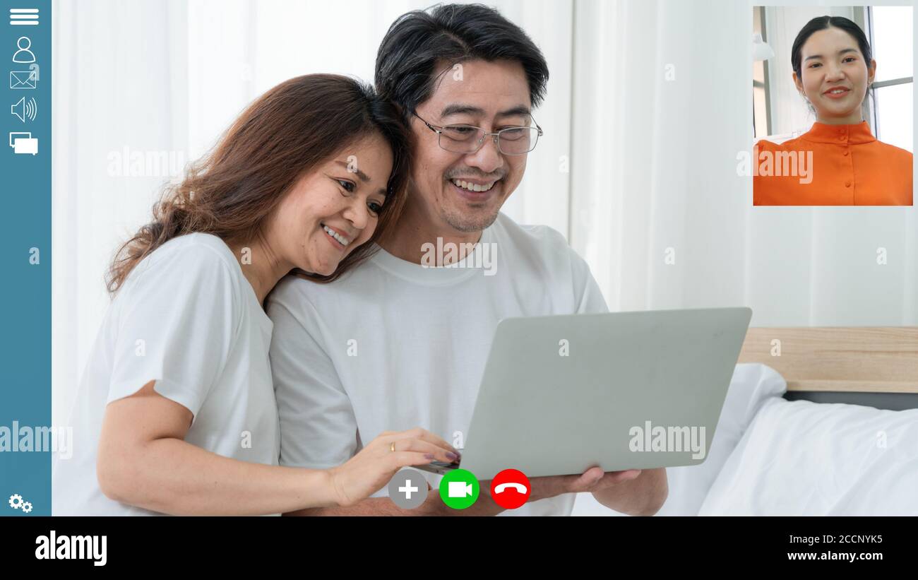 Happy family talking on internet video call at home Stock Photo