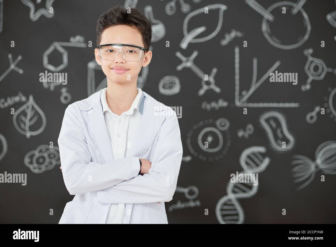 Vietnamese boy in labcoat and goggles Stock Photo