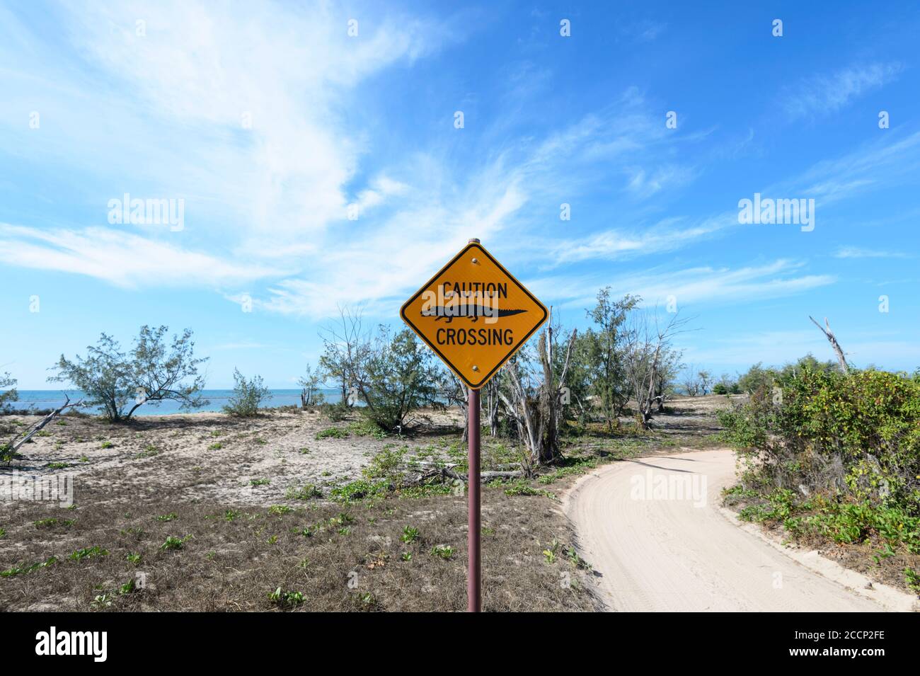 Road sign warning of crocodiles crossing, Garig Gunak Barlu National Park, Cobourg Peninsula, Arnhem Land, Northern Territory, NT, Australia Stock Photo