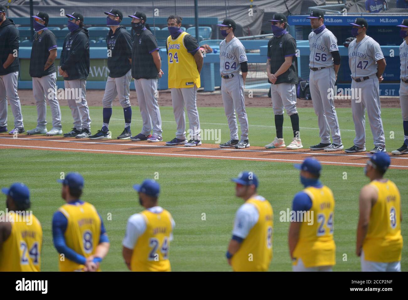 Los Angeles, United States. 23rd Aug, 2020. Every member of the Los Angeles Dodgers, as well as former Dodger and current Colorado Rockies' outfielder Matt Kemp (center, rear) donned one of Kobe Bryant's gold Lakers jerseys during a pregame remembrance at Dodger Stadium in Los Angeles on Sunday, August 23, 2020. The day was dedicated to the late Lakers legend, who was commemorated on what would have been his 42nd birthday. Photo by Jim Ruymen/UPI Credit: UPI/Alamy Live News Stock Photo