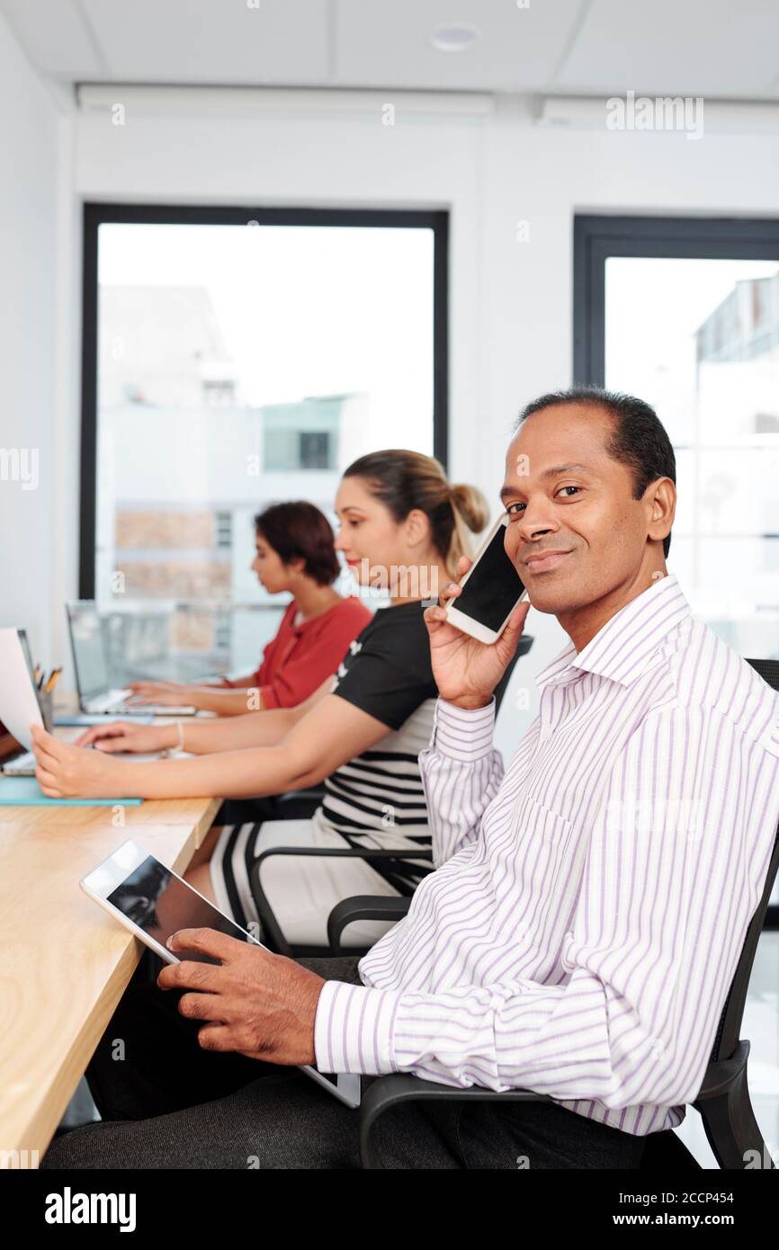 Smiling Indian businessman Stock Photo