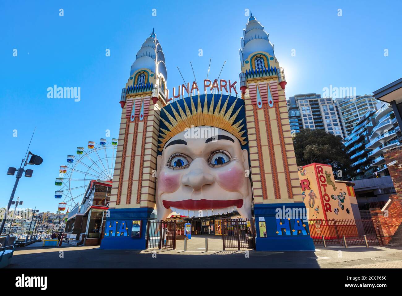 Luna Park, Sydney, Australia. The iconic smiling face entrance and the 35 meter tall Ferris wheel. May 30 2019 Stock Photo