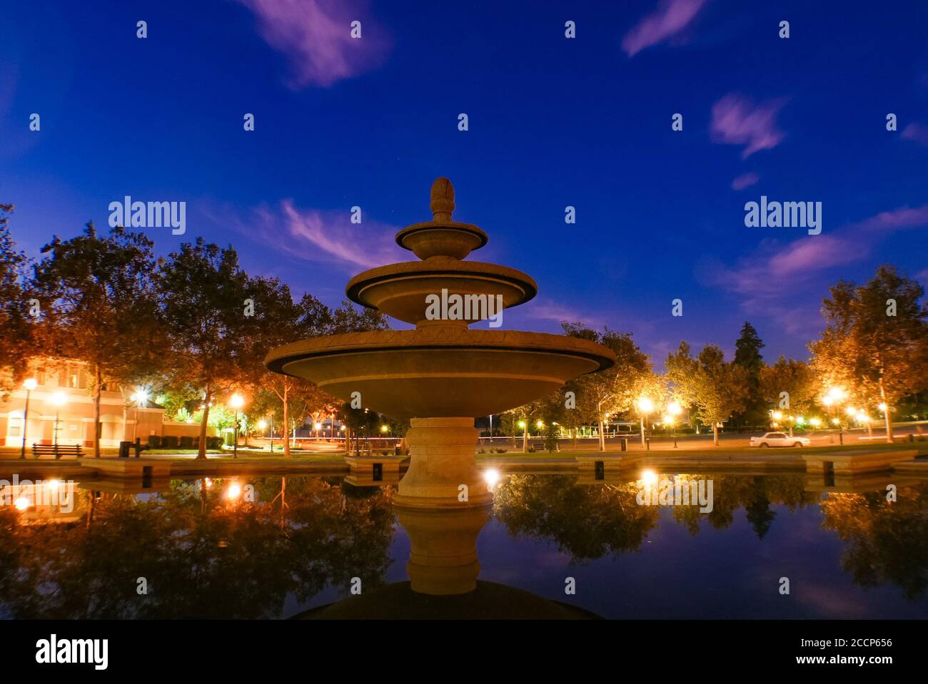 Reflection of the water fountain and the night sky in the water Stock ...