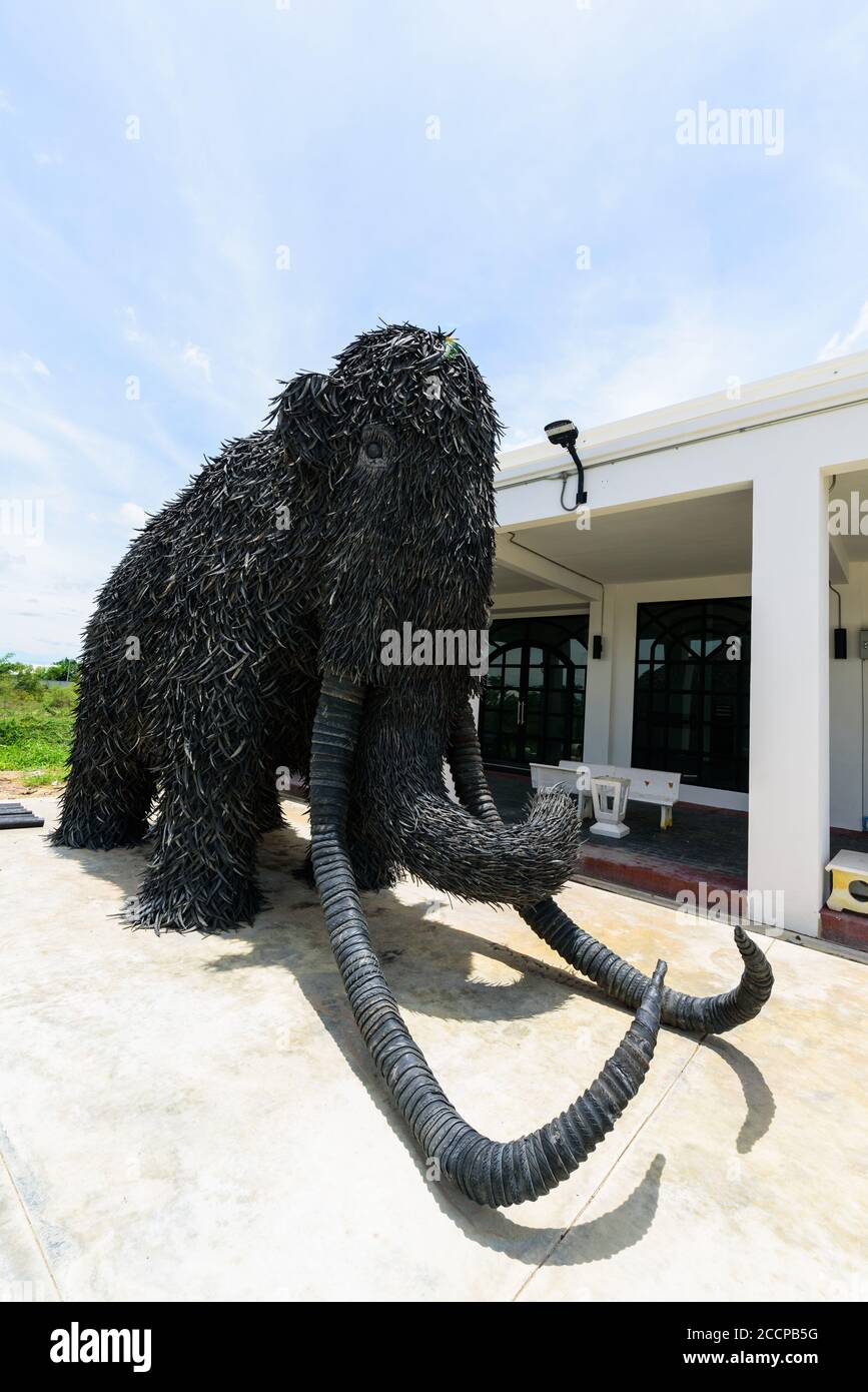NakhonPathom , Thailand -  6  August, 2020 : Big Mammoth model recycle made from old Car tire in  Caltex petrol station in NakhonPathom KM.14 Stock Photo