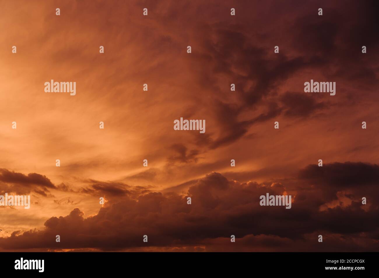 Beautiful sky with orange clouds in sky at sunset . Natural background. Stock Photo