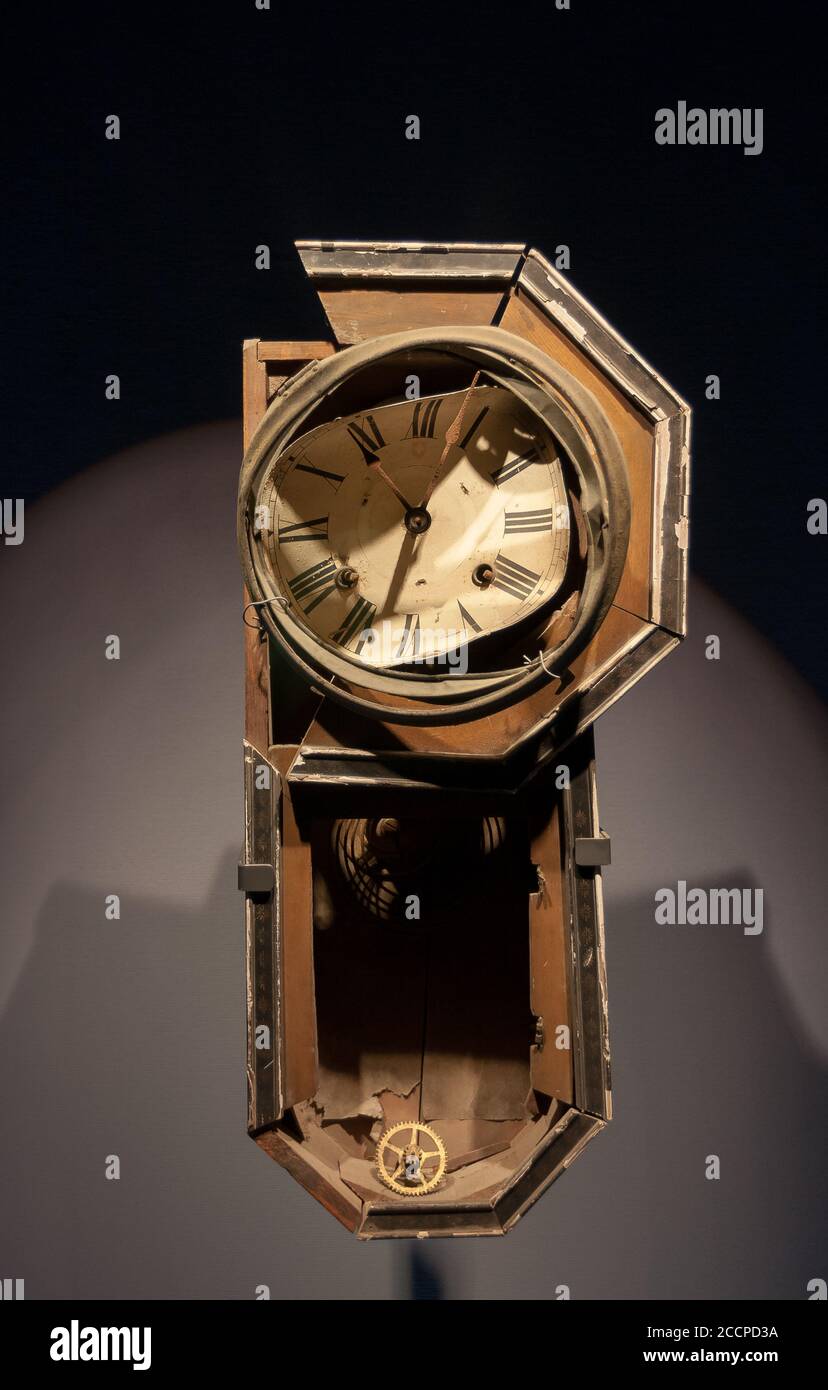 A wall clock, stopped at 11:02 and twisted and bent by the atomic blast,on display at Nagasaki Atom Bomb Museum. Japan, Stock Photo