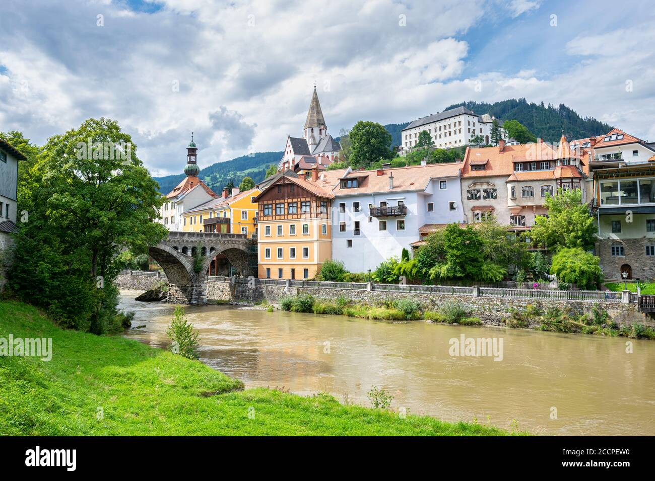 View of the town of Murau in state Steiermark, Austria. Scenic arch bridge over river Mur. Stock Photo