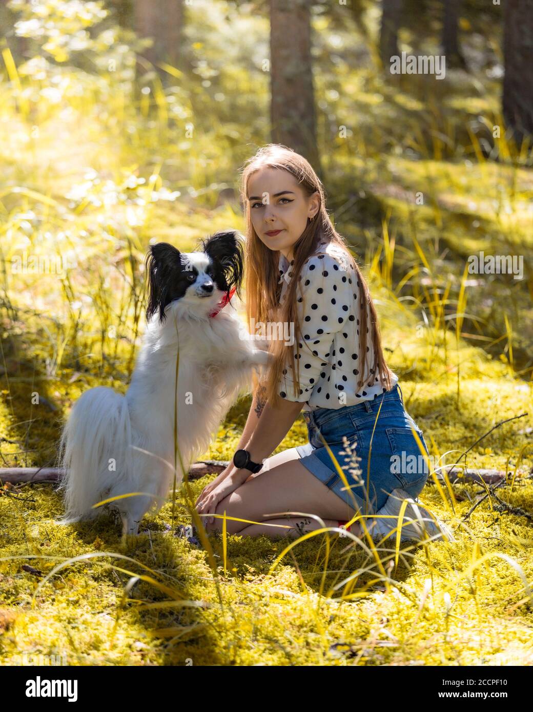 Cute girl with dog in summer forest Stock Photo - Alamy