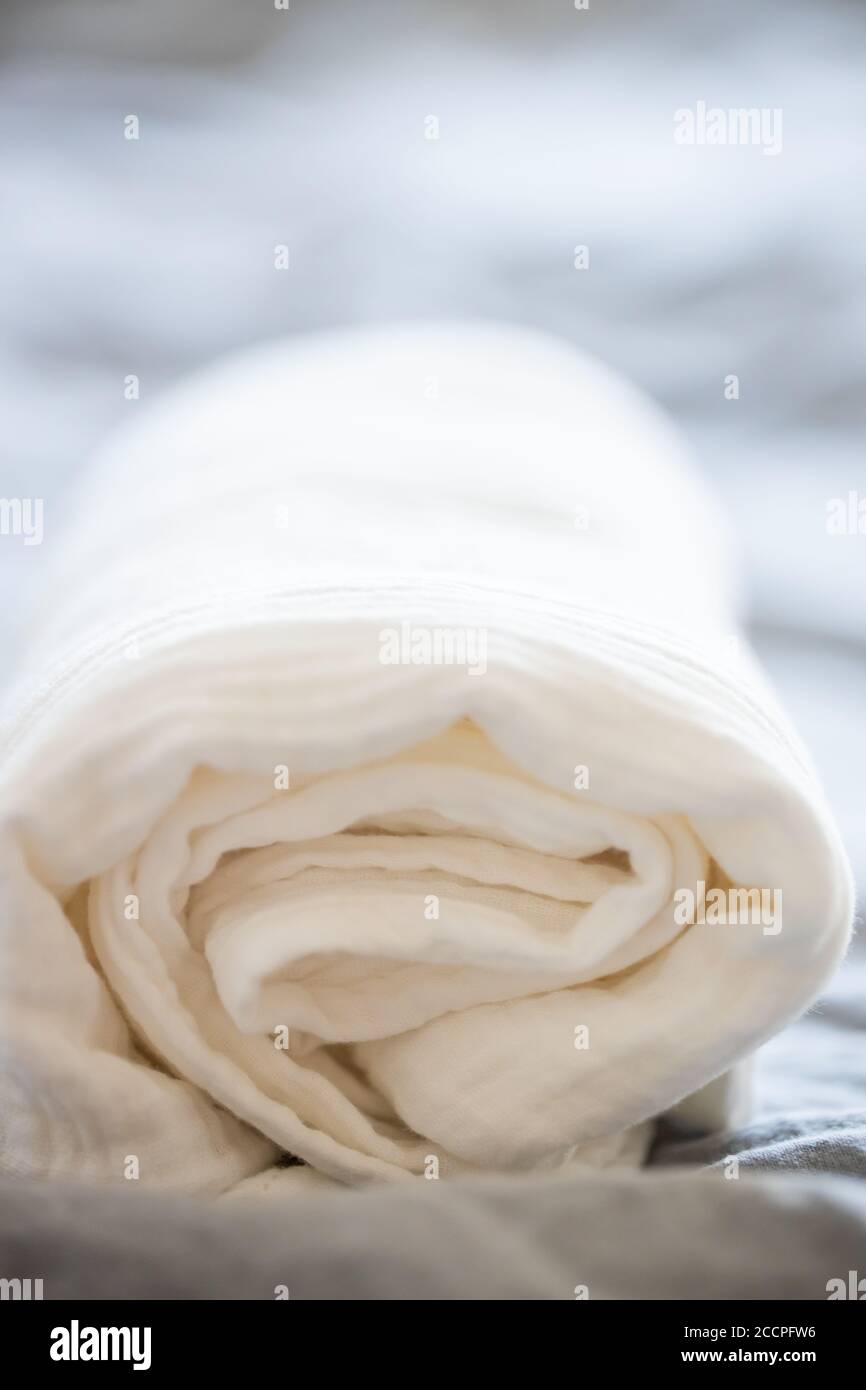 Beautiful white muslin fabric on a grey background. Fabric, textiles, clothing concepts Stock Photo