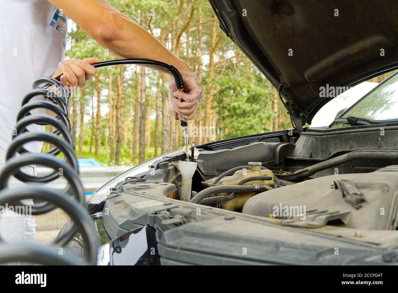 Closeup Of Man Topping Up Windshield Washer Fluid In Car Stock Photo -  Download Image Now - iStock