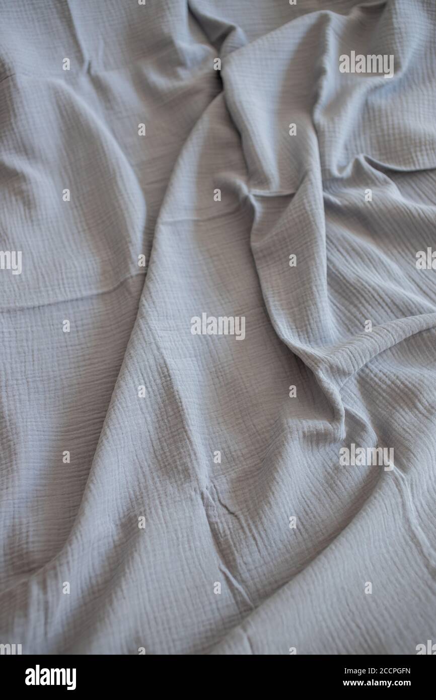 Beautiful gray muslin fabric, top view. textiles, clothing concepts Stock Photo