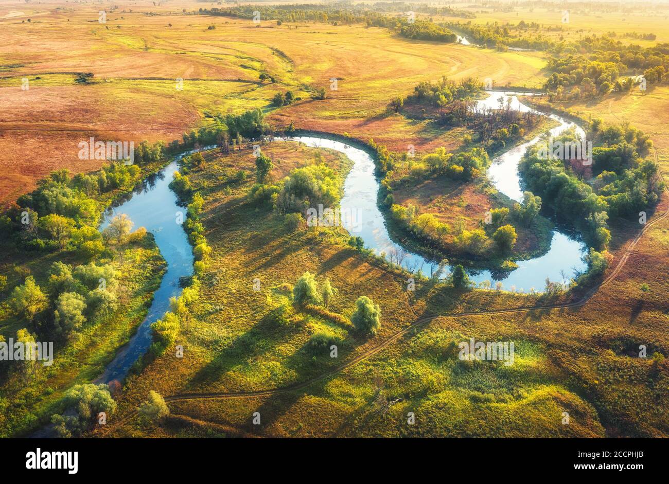 Aerial view of beautiful curving river at sunrise in summer Stock Photo