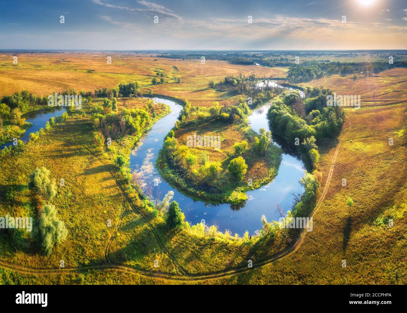 Aerial view of beautiful curving river at sunrise in summer Stock Photo
