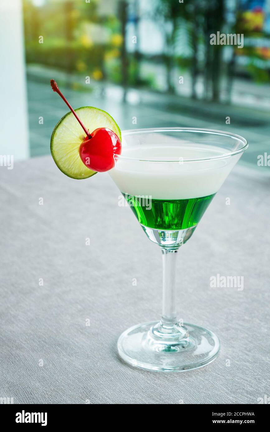 Cocktail glass at swimming pool. Stock Photo