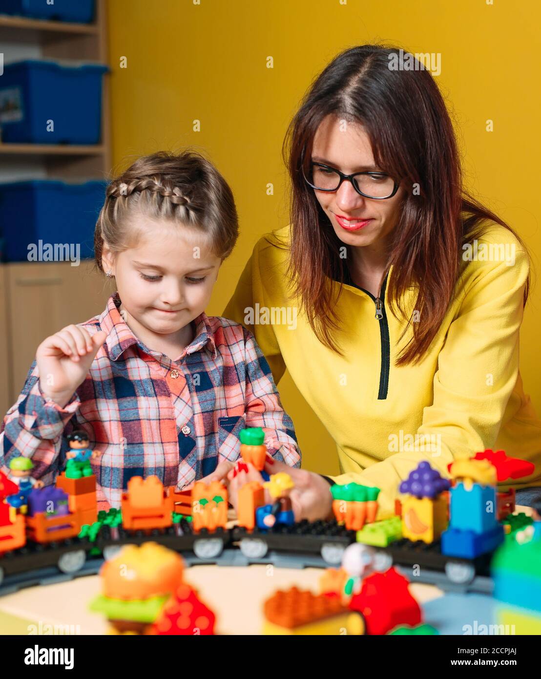 Educational toys for preschool and kindergarten child. Child playing with constructor blocks at