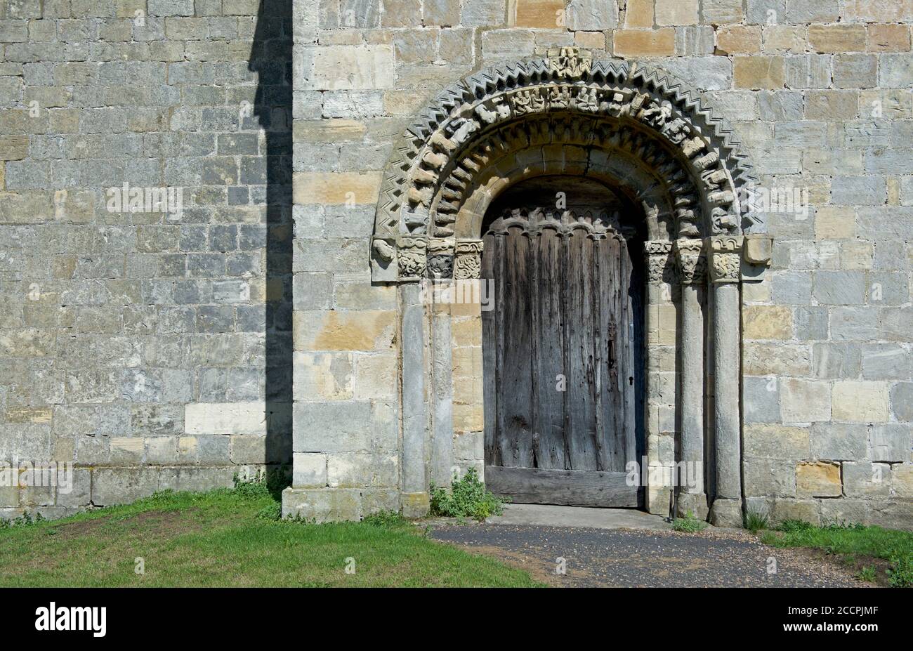 Norman doorway of St John the Baptist's Church in the village of Healaugh, North Yorkshire, England UK Stock Photo