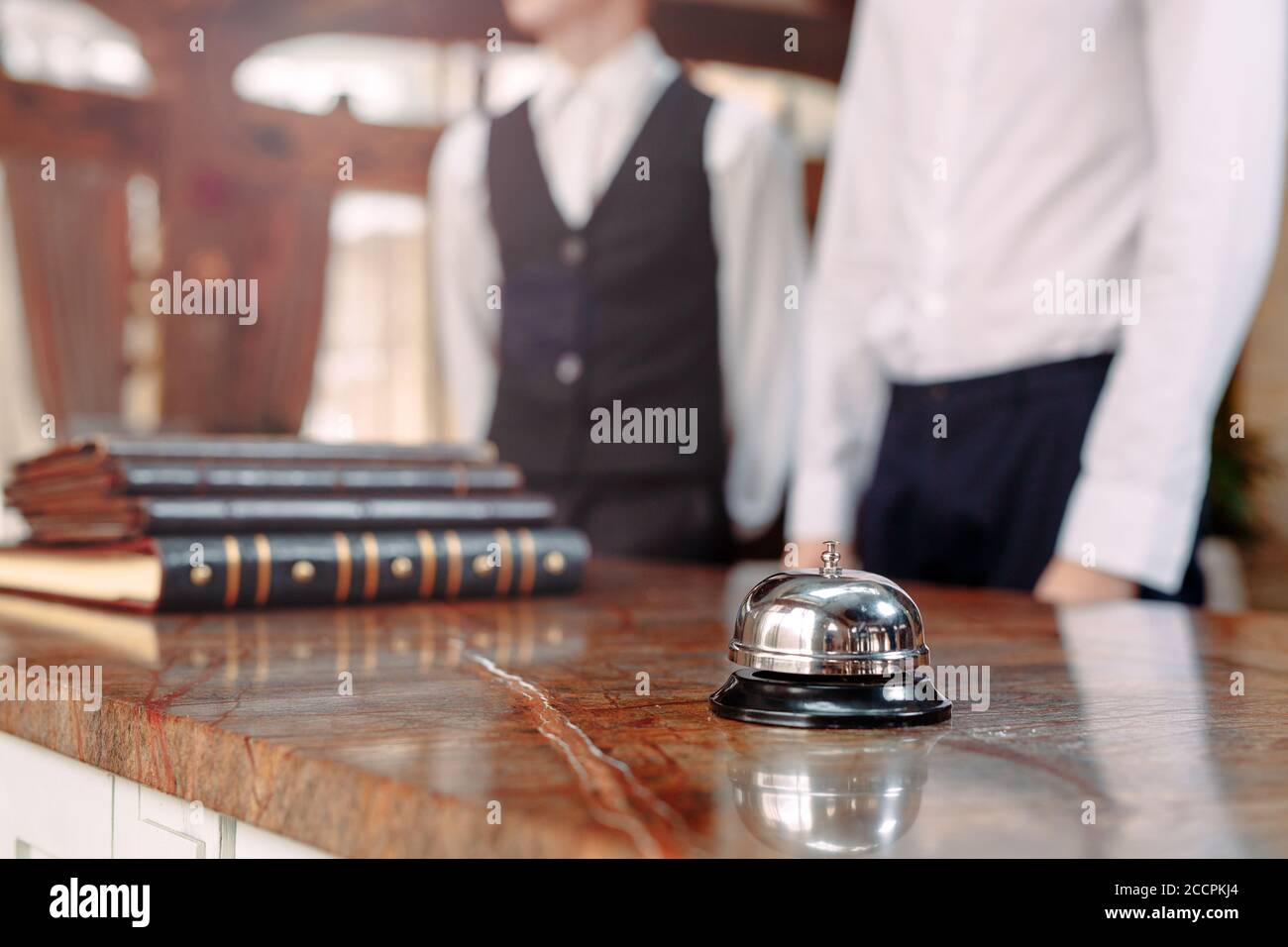 Hotel service bell Concept hotel, travel, room,Modern luxury hotel reception counter desk on background. Stock Photo