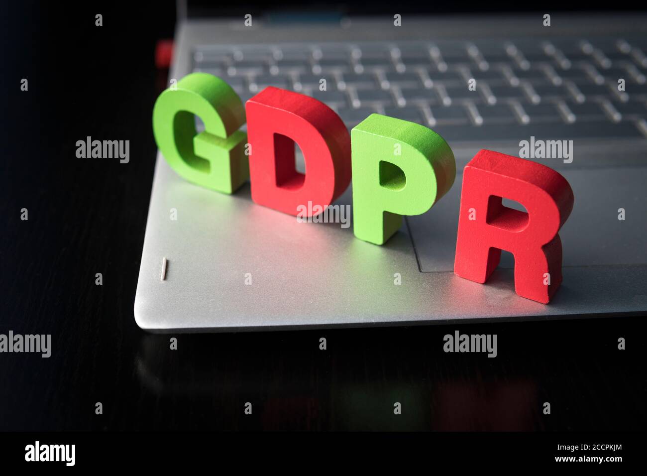 General Data Protection Regulation - GDPR wooden letters set on the bottom of laptop at black background. Data Protection Concept. Privacy in internet Stock Photo