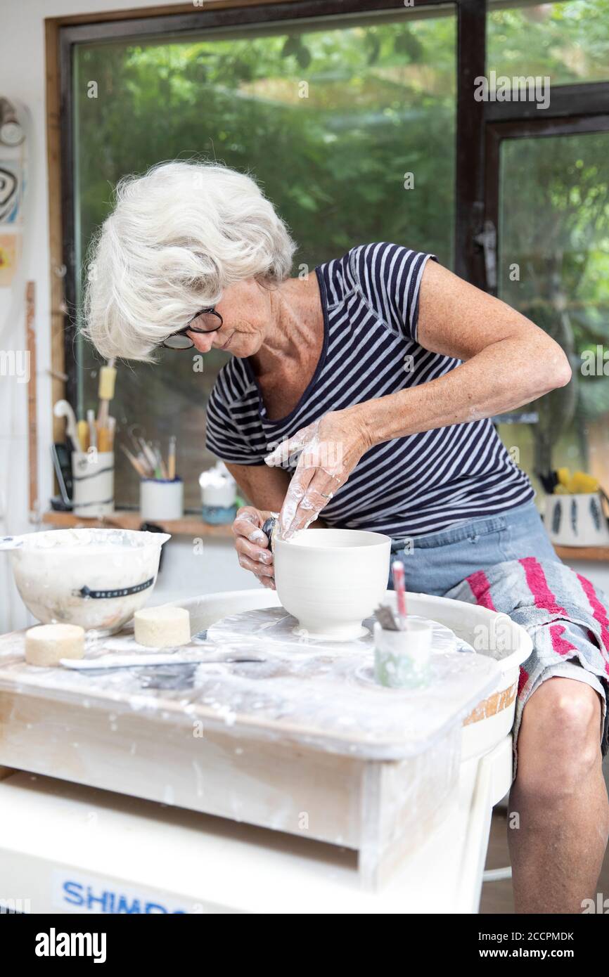 ceramicist at work in her studio Stock Photo Alamy