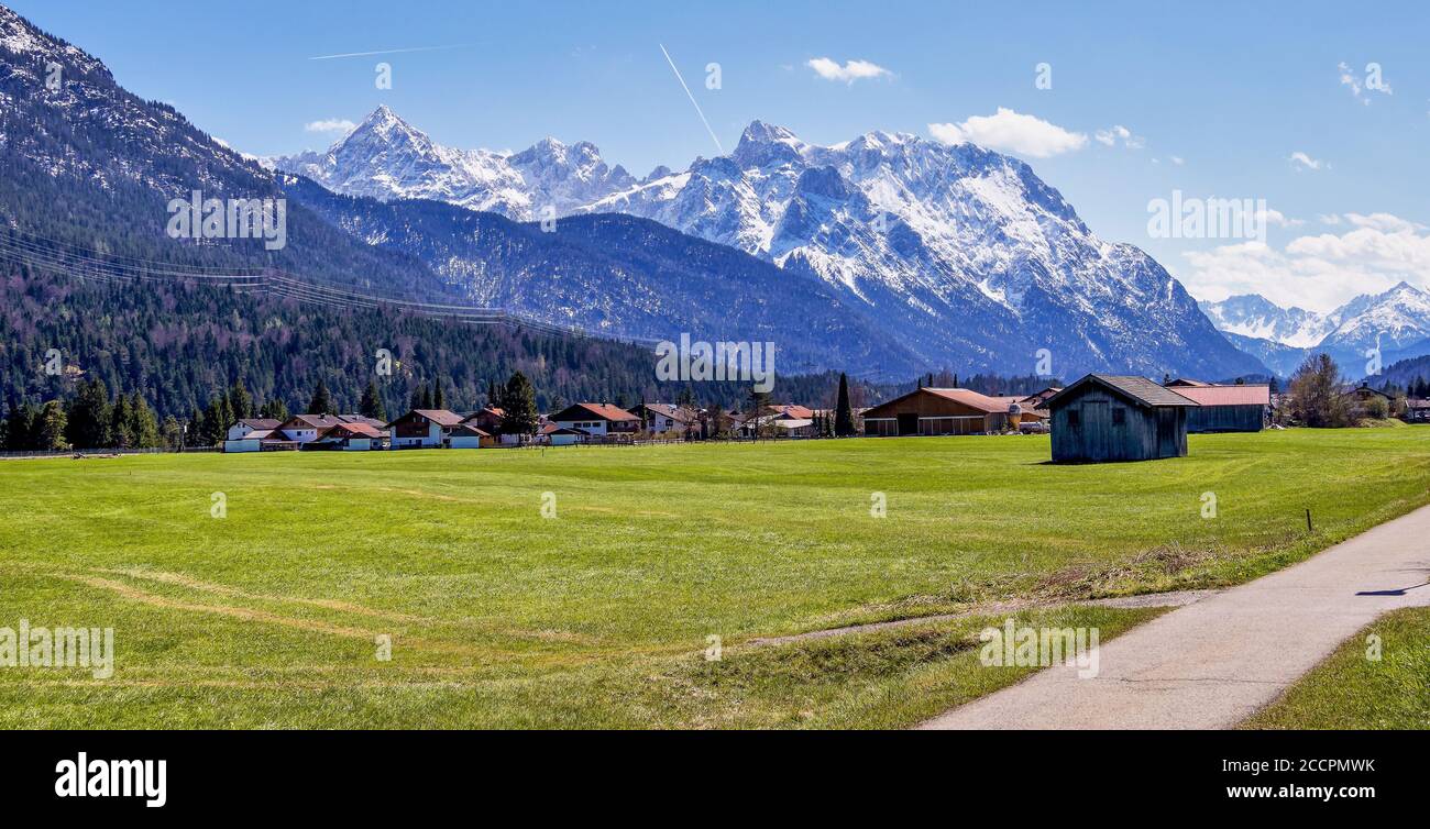Wetterstein mountains. View from Wallgau, Bavaria, Germany. Road through the ammergau foothills with spectacular mountain view. Stock Photo