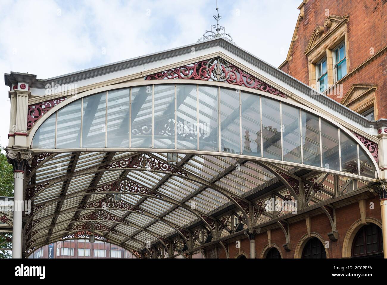 Wrought iron and glass canopy spanning the taxi rank on the forecourt of Marylebone railway station, Marylebone, London, England, UK. Stock Photo