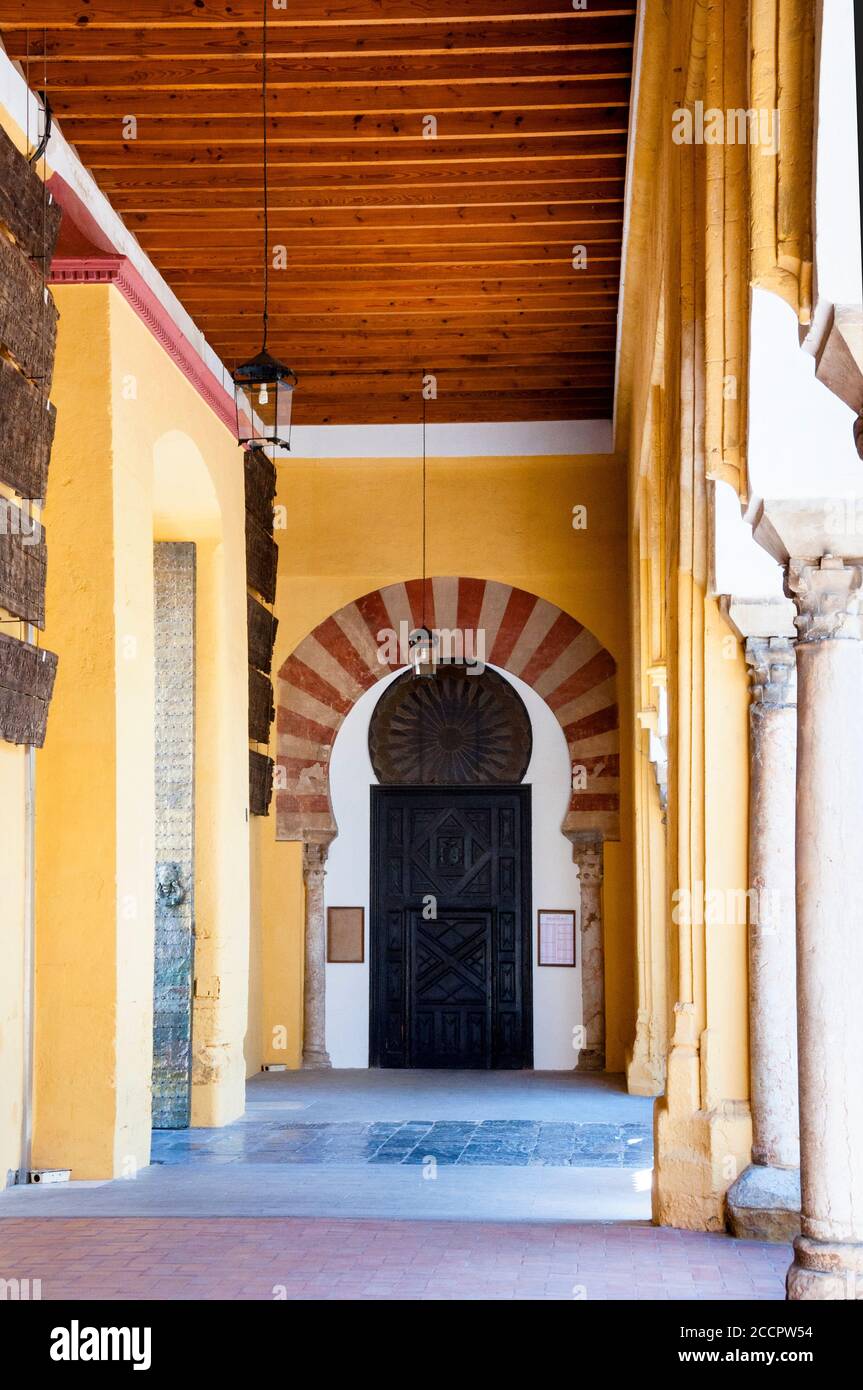 Alternating red and white voussoirs horseshoe arch at the Great Mosque of Cordoba in southern Spain. Stock Photo