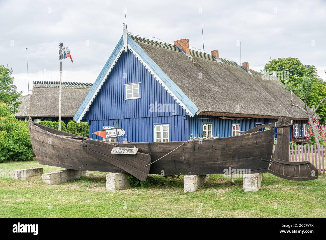 Traditional fisherman's house in Nida, Lithuania. Nida is a resort town in Lithuania. Located on the Curonian Spit between the Curonian Lagoon and the Stock Photo