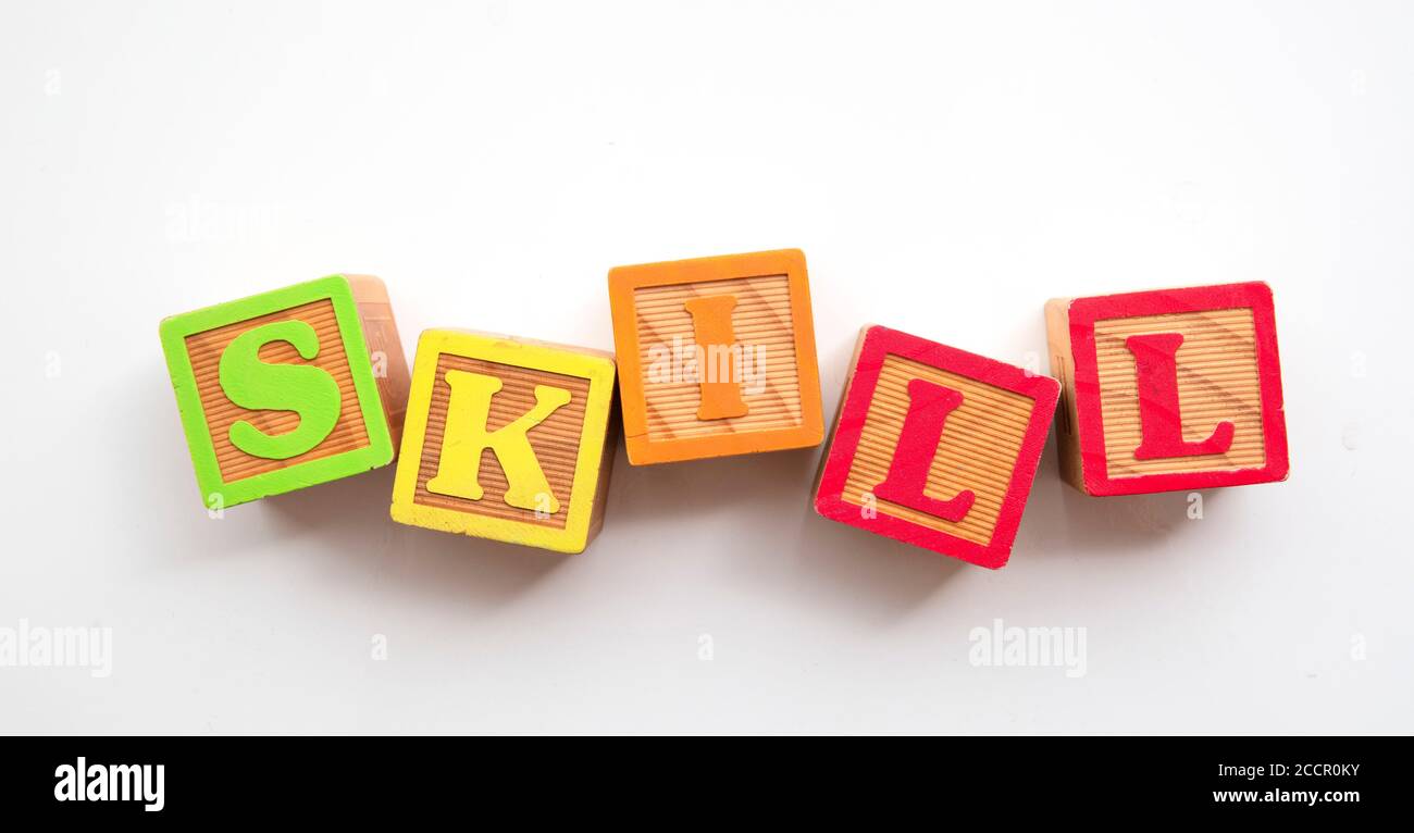 Skill word made from colourful wooden baby development blocks Stock Photo