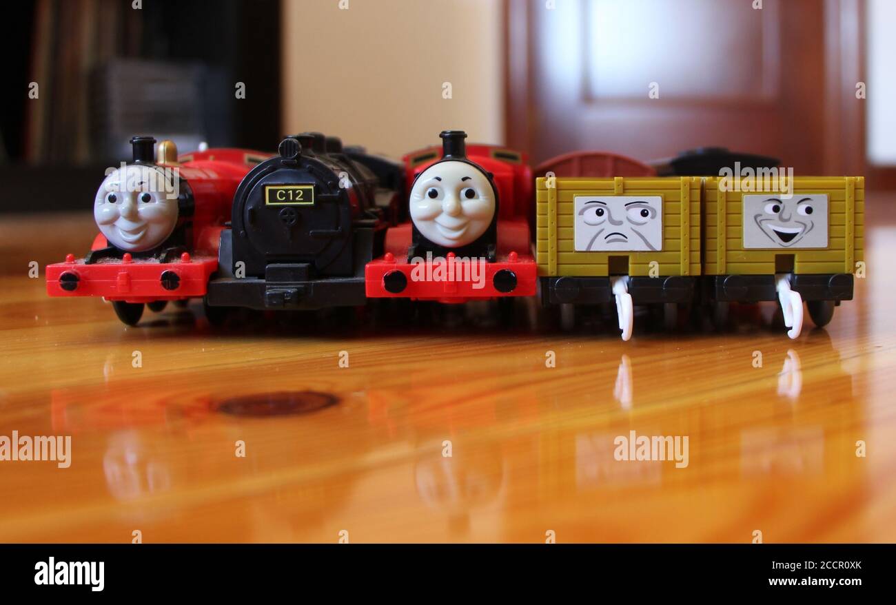 Photo of a Collection of battery powered trains troublesome trucks and box  wagons from a Thomas the Tank Engine toy set Two James and C12 tank engine  Stock Photo - Alamy