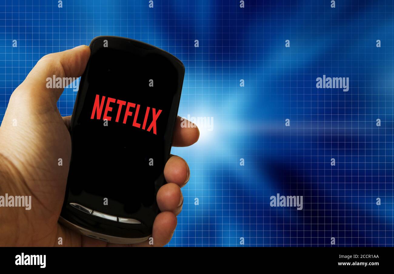 watching Netflix on a smartphone Stock Photo
