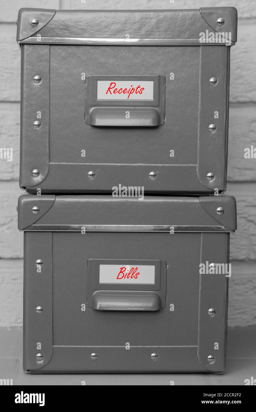 Storage boxes with receipts and bills written on labels in red. With a