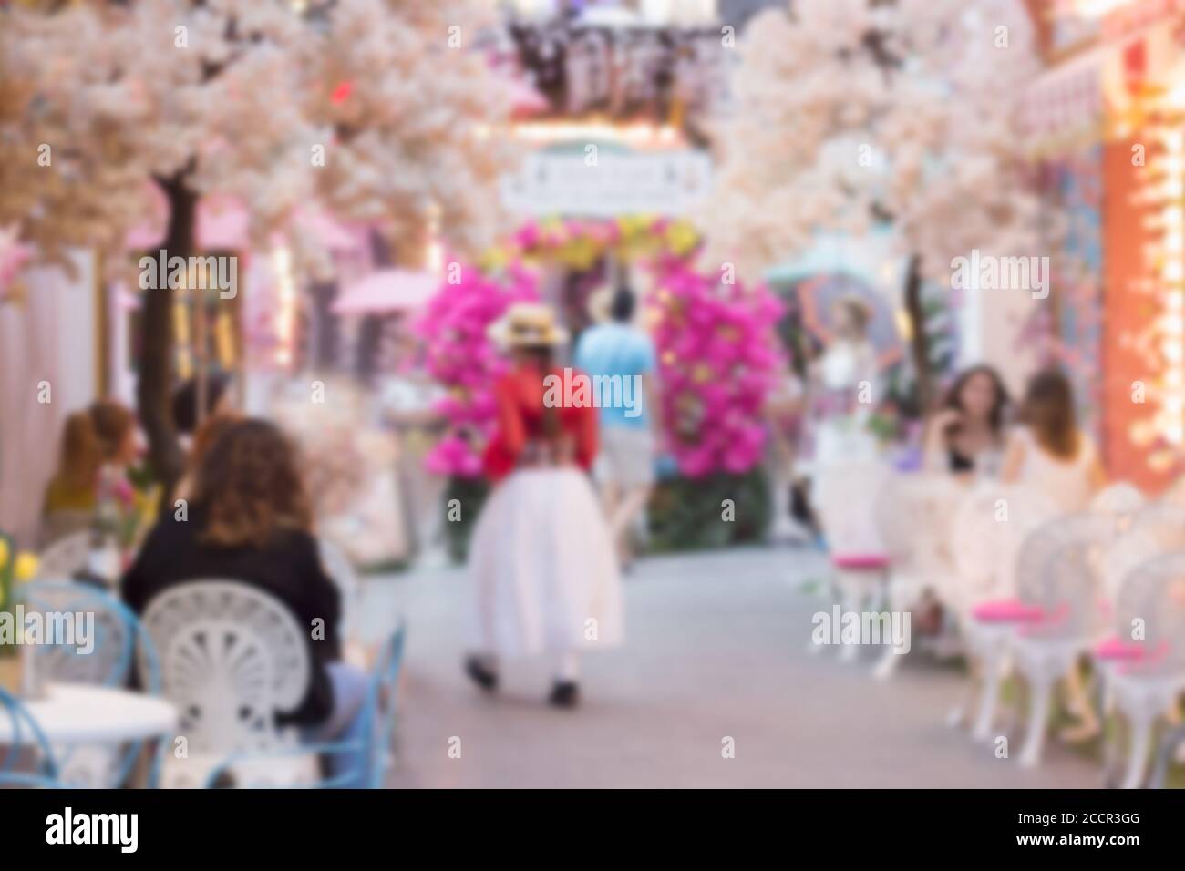 People in Coffee shop blur background; summer, streets of Athens Stock Photo