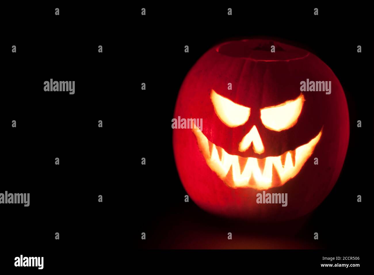 Scary lighted Jack O´Lantern halloween carved pumpkin on black ...