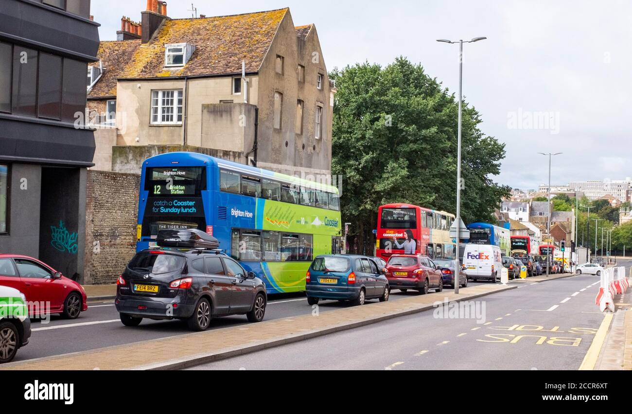 Brighton UK 24th August 2020 - Public transport buses stuck in traffic congestion heading into the city in Edward Street Brighton today Stock Photo