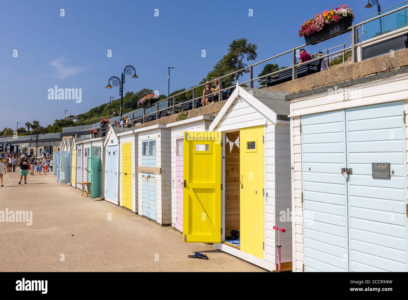 Beach huts along Marine Parade promenade in Lyme Regis, a popular seaside town holiday resort on the Jurassic Coast in Dorset, south-west England Stock Photo