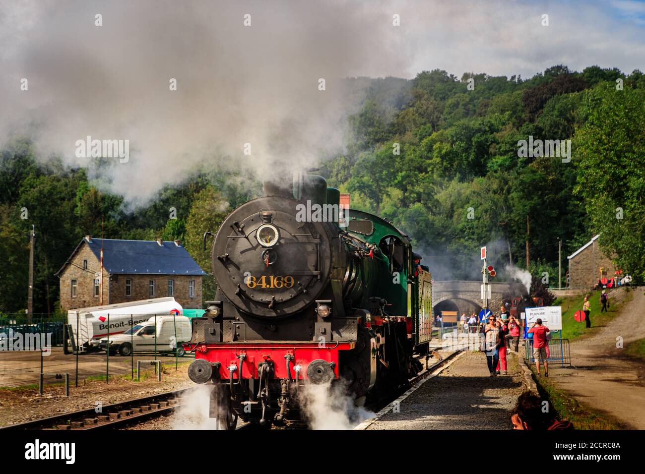 Spontin, Belgium - August 16 2014 : Front view on old Belgian black steam engine locomotive from TSP/PTF association pumping steam and smoke Stock Photo