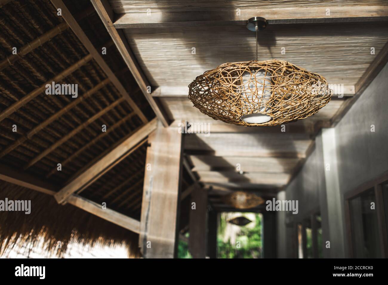 Contemporary wooden and ecofriendly furniture. Handmade wicker rattan chandelier. Home interior