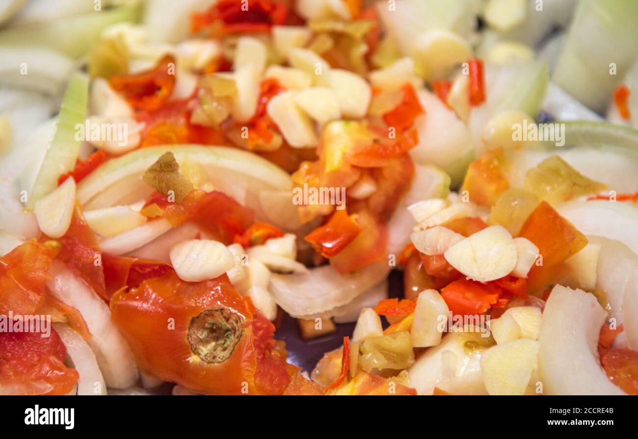 A salad prepared in a Brazilian restaurant with sliced onions, red tomatoes, garlic and chopped peppers. Southern Brazilian cuisine. Stock Photo