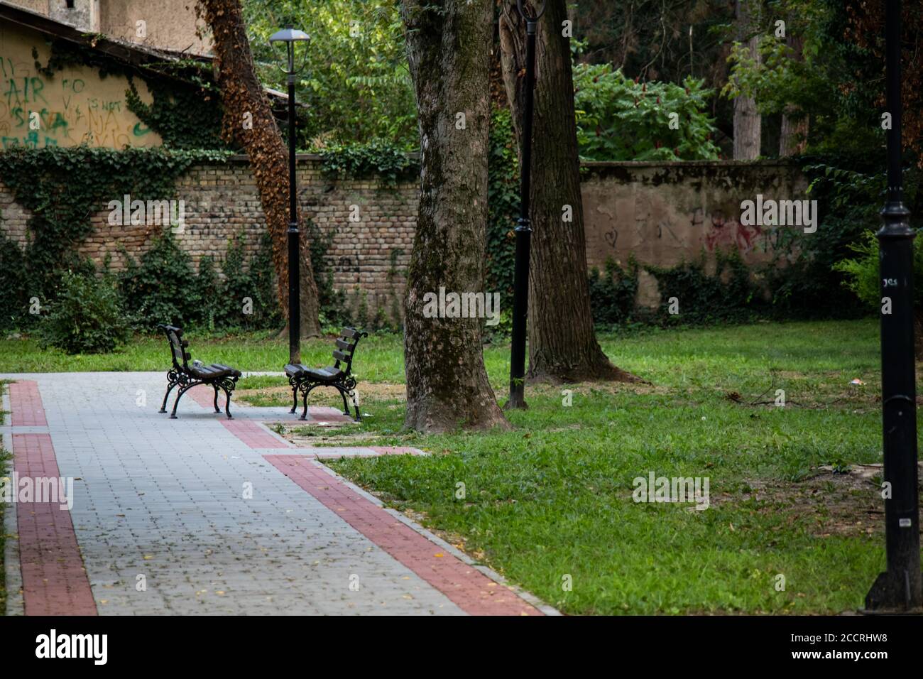two benches in the park facing each other in Sombor, Serbia Stock Photo ...