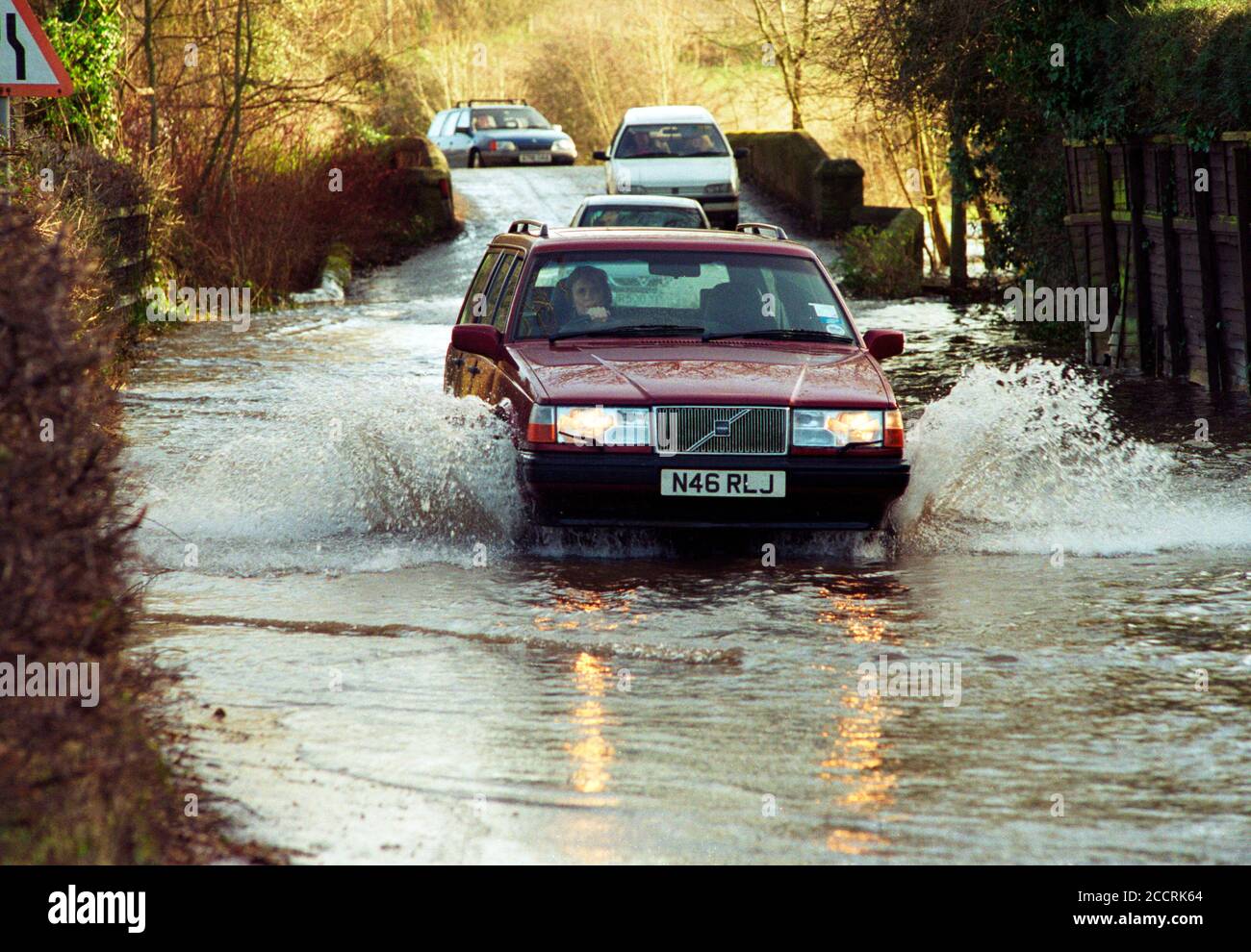 A 1990s Volvo estate splashes through the floods in Salisbury 2000. UK Stock Photo
