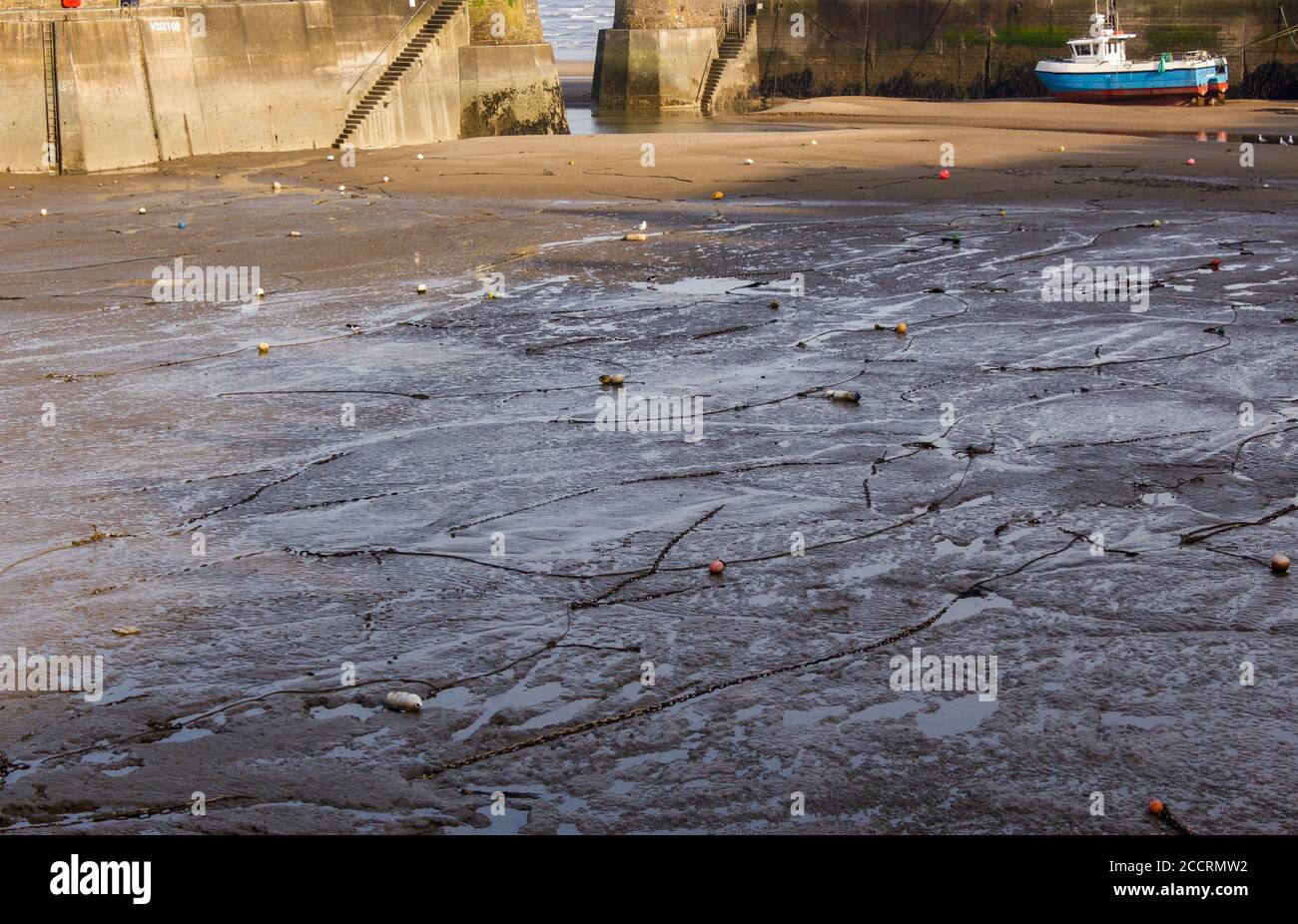 Sand bed of harbour at low tide Stock Photo