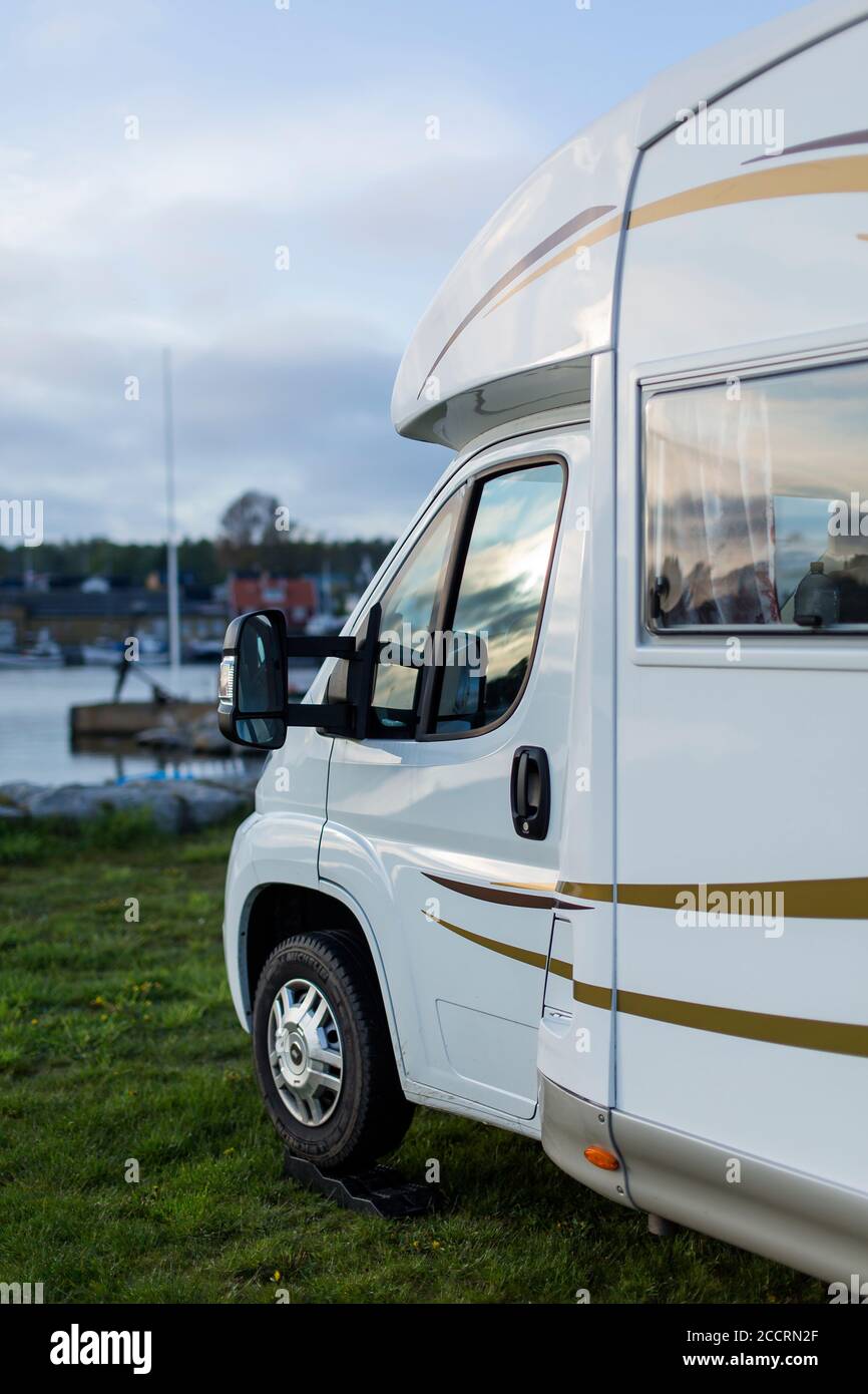 Front of a motorhome parked at a campground. Stock Photo